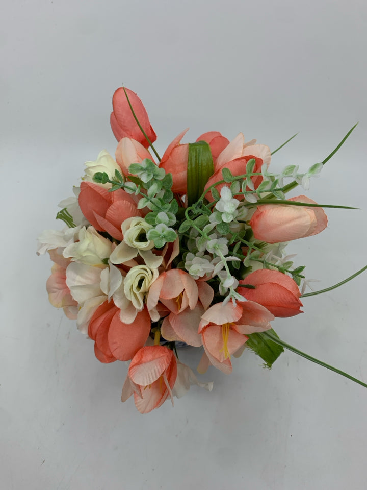 PINK AND WHITE FAUX FLORAL IN BLUE AND WHITE VASE.