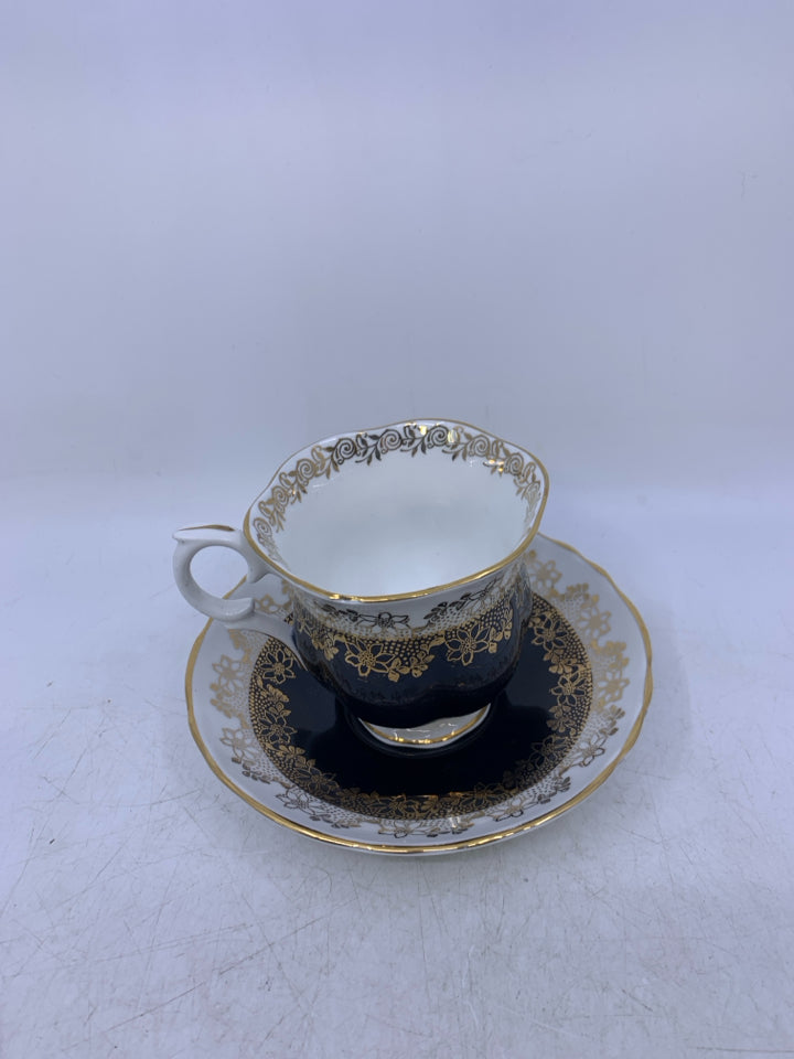 BLACK/WHITE W/ GOLD LACE DETAIL TEACUP/SAUCER.