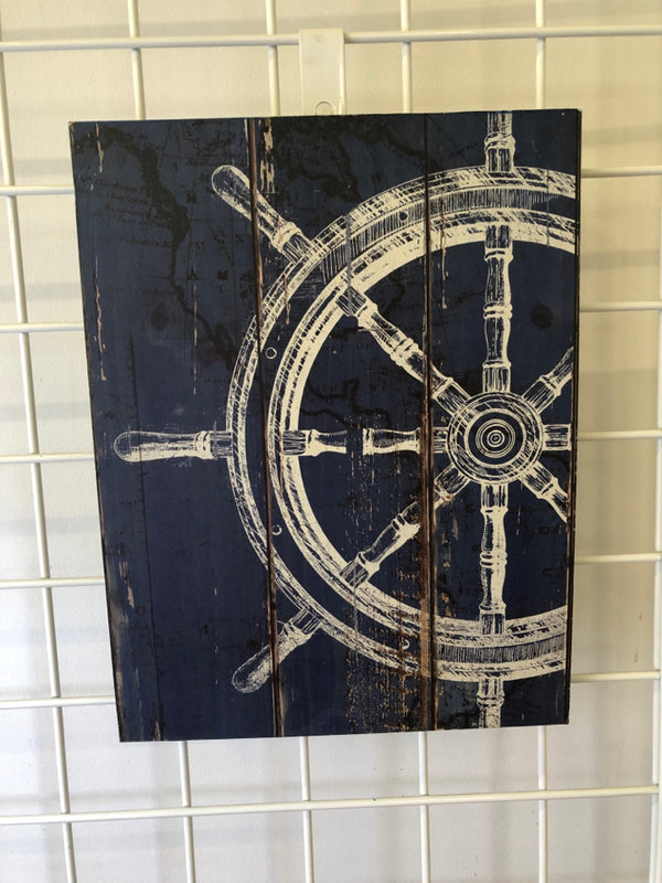 DISTRESSED WHITE SHIP WHEEL ON BLUE BACKGROUND WALL HANGING.