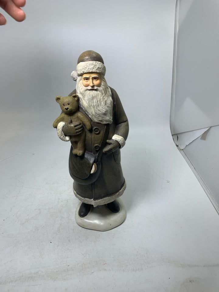 RESIN SANTA IN BROWN SUIT HOLDING TEDDY BEAR.