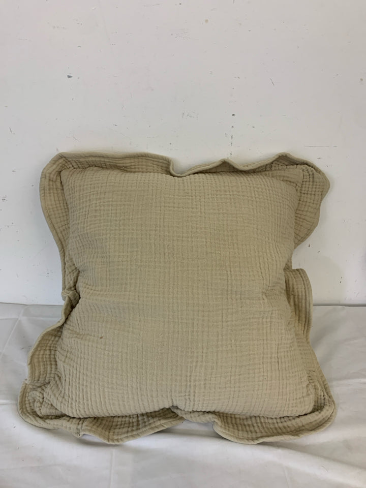 TAN RUFFLED EDGE SQUARE PILLOW.