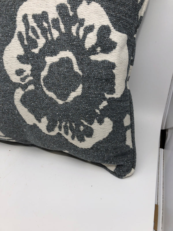 WHITE W/ BLUE/GRAY FLORAL PATTERN PILLOW.