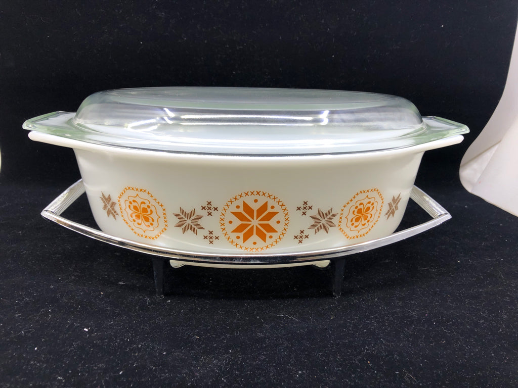 VTG OVAL ORANGE AND BROWN COVERED BAKING DISH W METAL HOLDER.