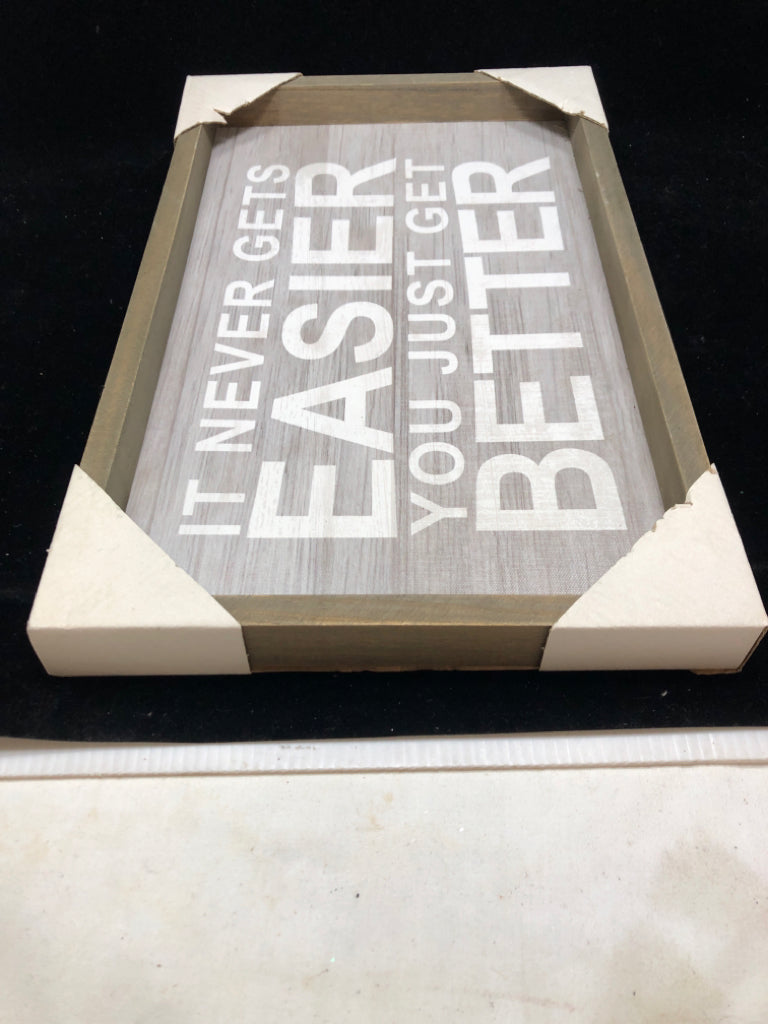 NEW IT NEVER GETS EASIER WALL HANGING.