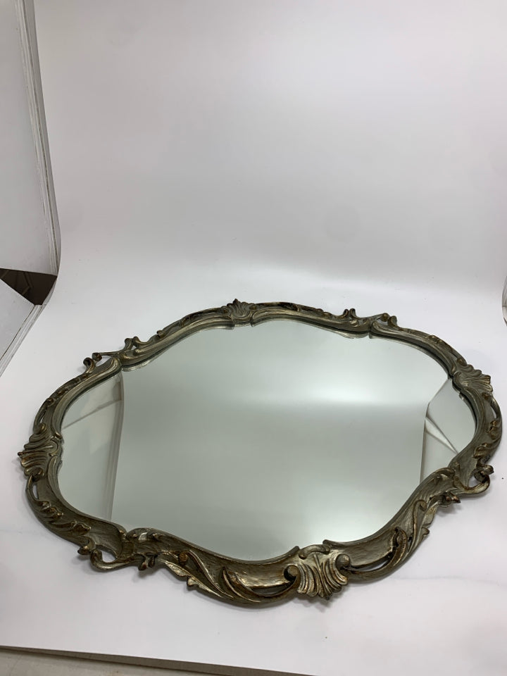 ORNATE SILVER FRAMED OVAL MIRROR.