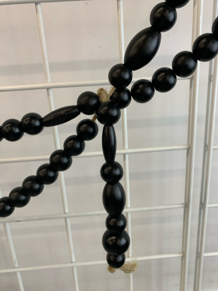 BLACK WOODEN BEADED GARLAND.