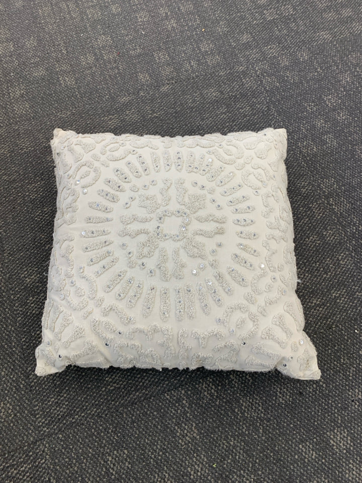 CREAM SEQUINS TEXTURED PILLOW.