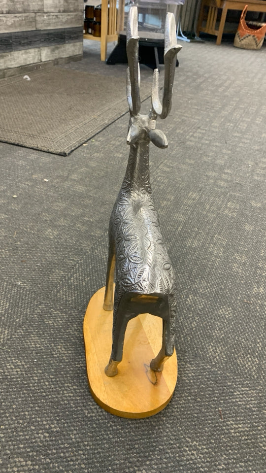 SILVER TEXTURED REINDEER W/WOOD BASE SCULPTURE.