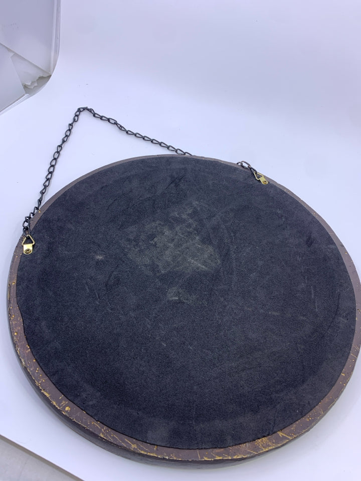 DARK WOOD CIRCLE SCROLL MIRROR IN BACK WALL ART.
