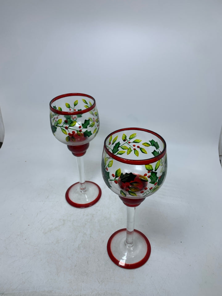 2 HOLLY/MISTLETOE PAITNED FOOTED CANDLE HOLDERS.