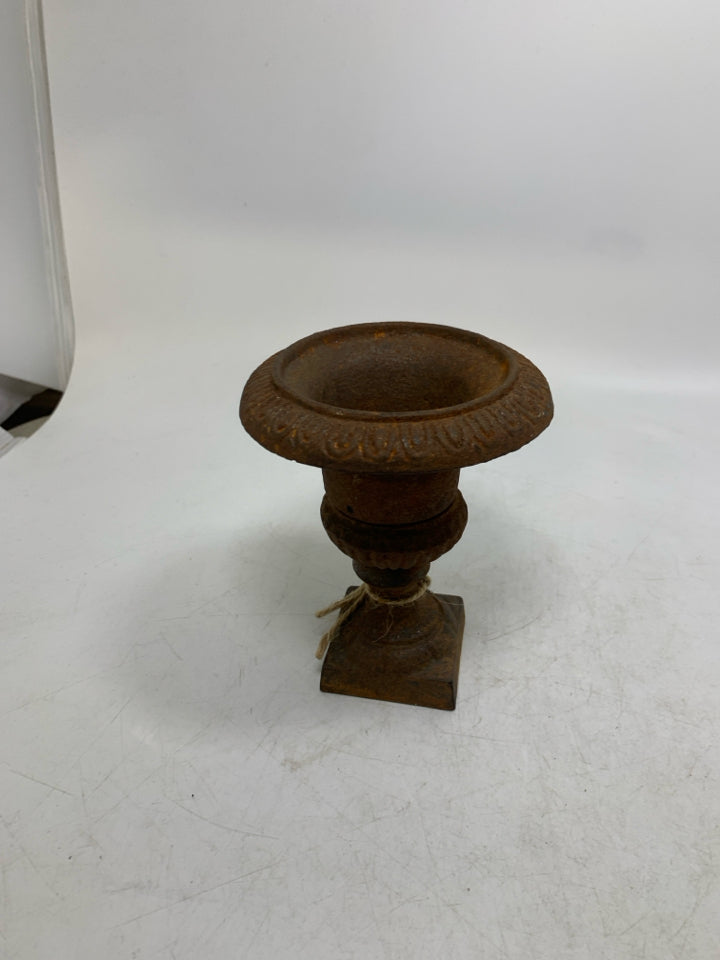 RUSTED HEAVY METAL FOOTED VASE.