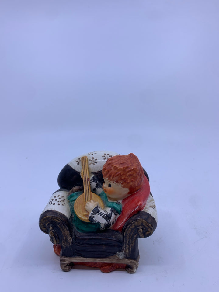 REDHEAD KID PLAYING BANJO ON CHAIR FIGURE.