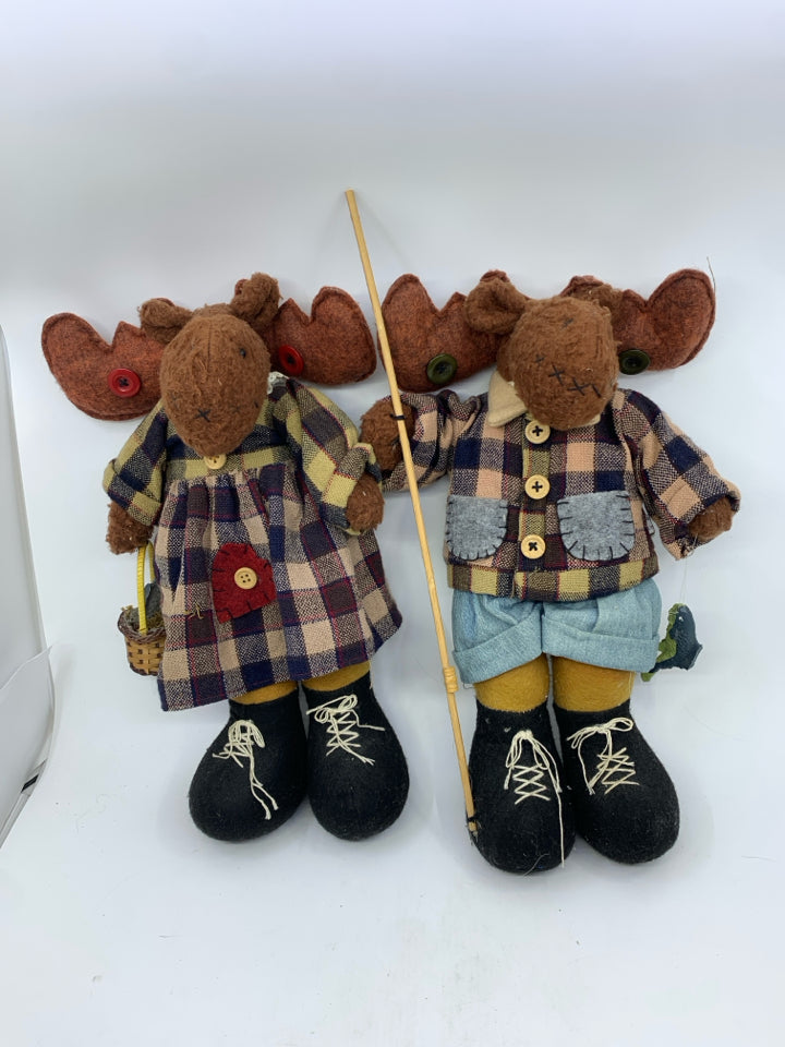 2 PLUSH MOOSE IN PLAID ON HOLDING FISHING GEAR HEAVY FEET.