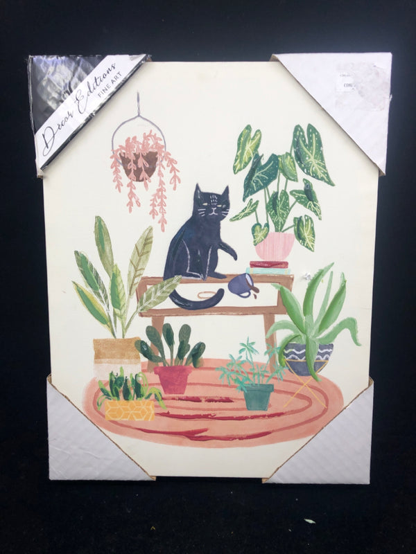 BLACK CAT WALL CANVAS SITTING ON PLANT STAND KNOCKING OVER COFFEE.