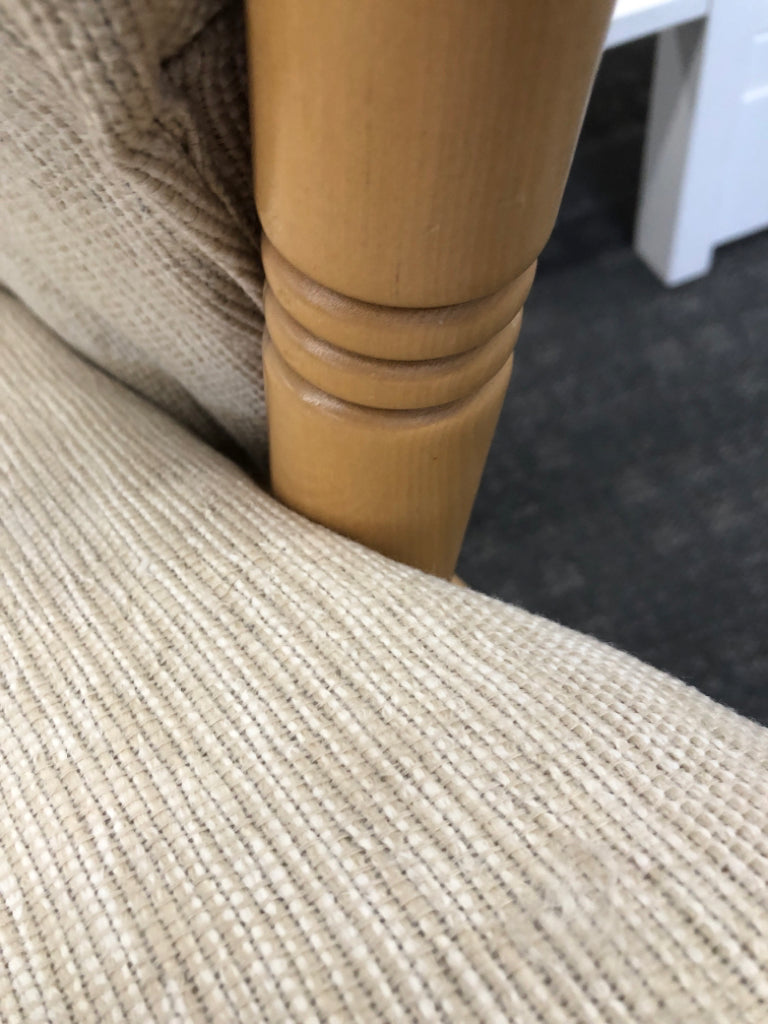 BLONDE WOODEN ROCKING CHAIR W/LEVER TO LOCK & BEIGE CUSHION.