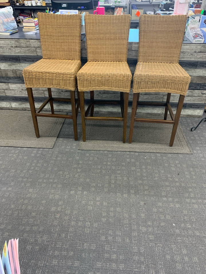 3 BROWN WICKER BAR STOOLS.