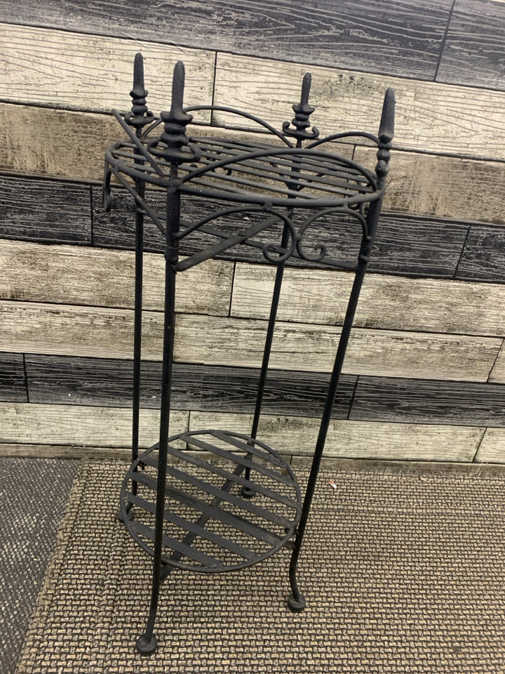 BLACK 2 TIER PLANT STAND W/ POINTED EDGES.