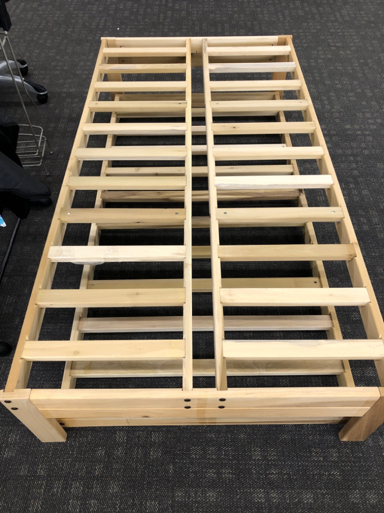 LIGHT WOOD TWIN PLATFORM WITH TRUNDLE BED.