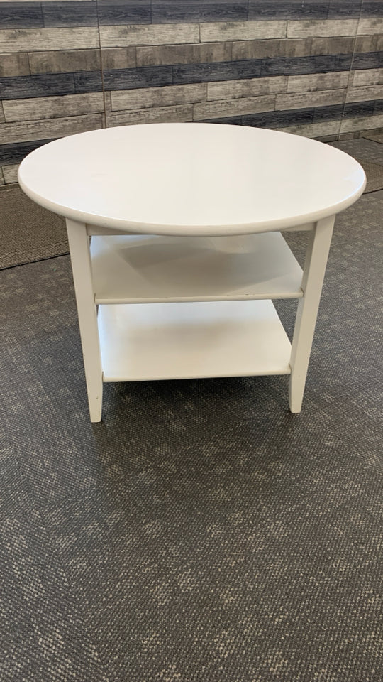 3-TIER WHITE CIRCLE TABLE.