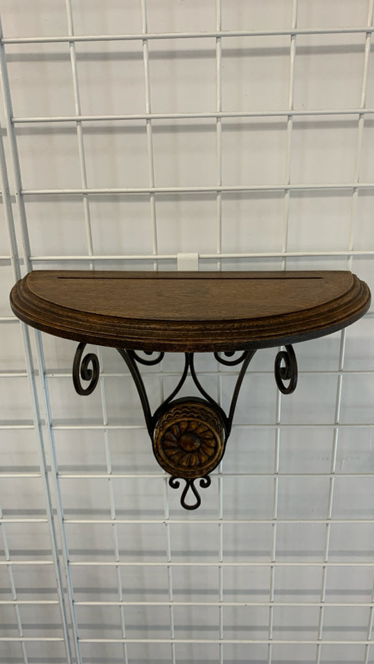 HALF CIRCLE WOOD WALL SHELF W/BROWN METAL SCROLL BASE.
