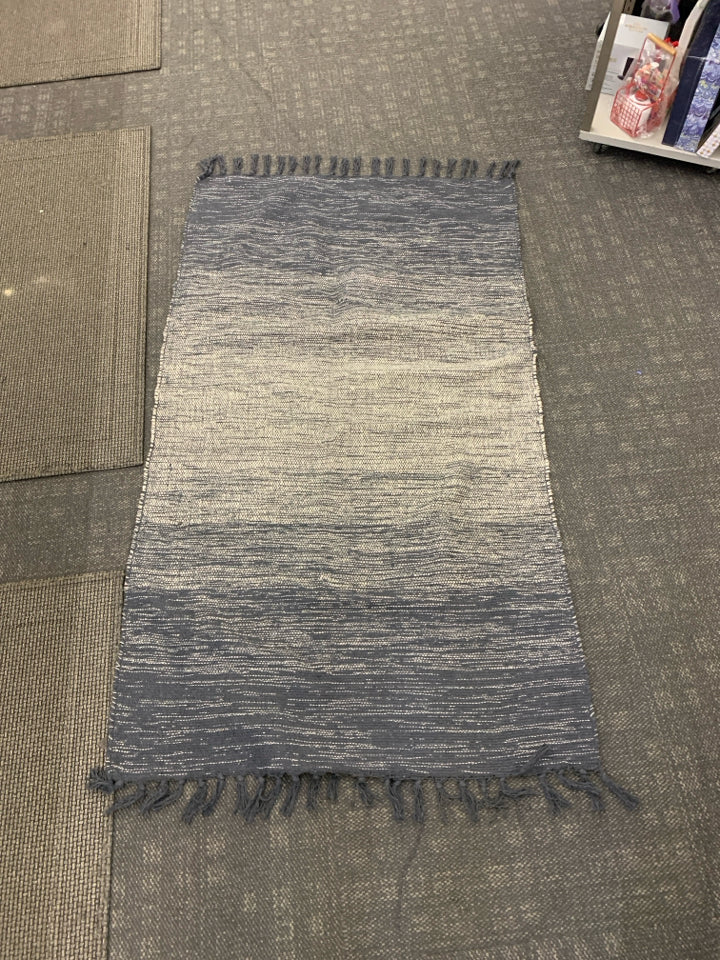 NAVY BLUE AND WHITE AREA RUG.