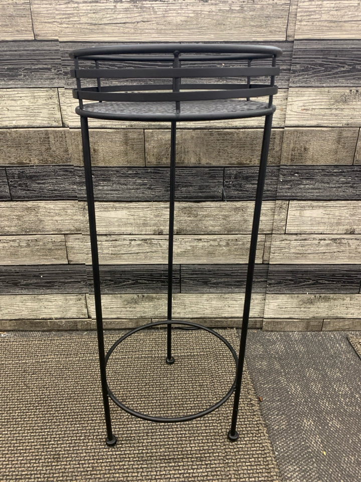 BLACK METAL PLANT STAND FLOWER PIECED BASE.