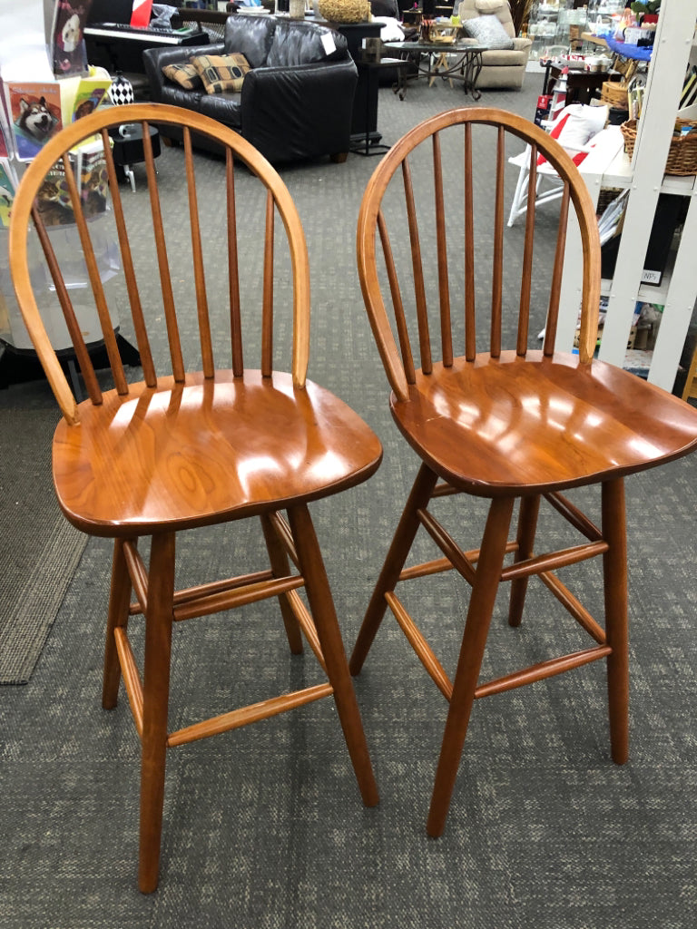 2 TALL WOOD SWIVEL BAR STOOLS.