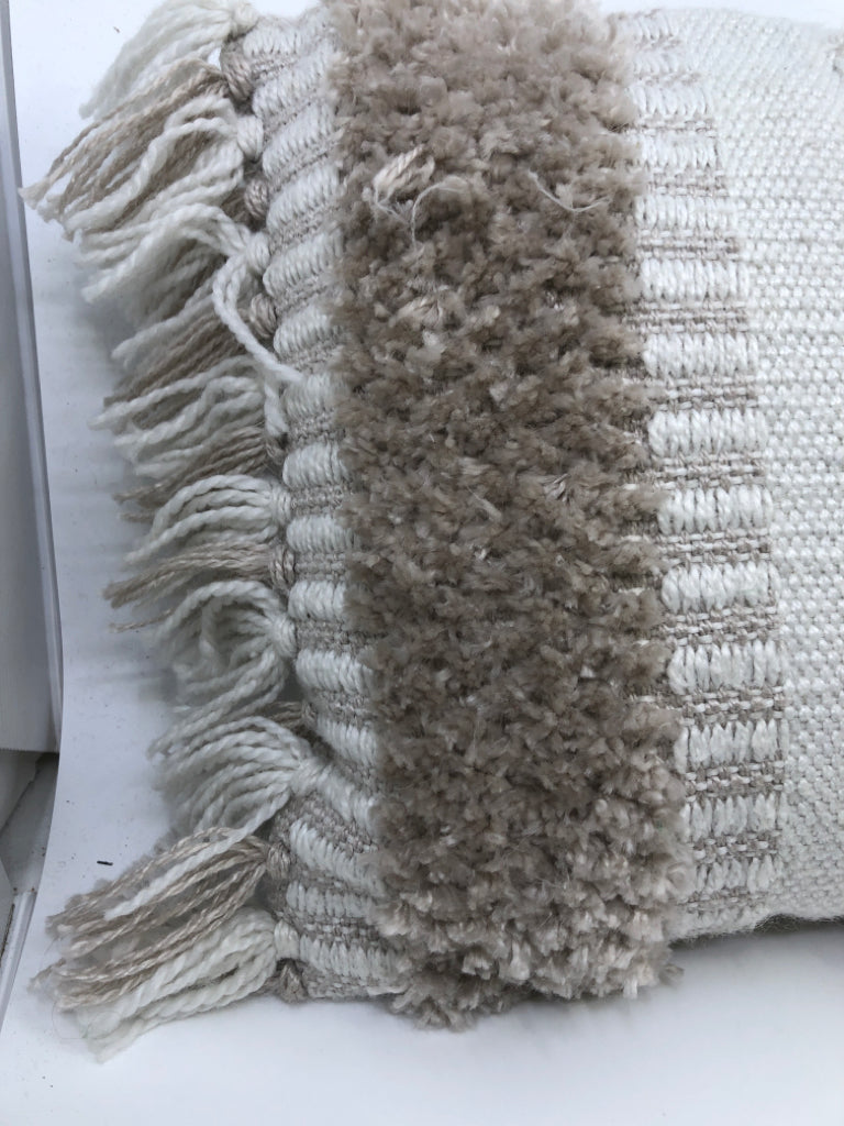 RECTANGLE TAN AND CREAM PILLOW W/FRINGE.