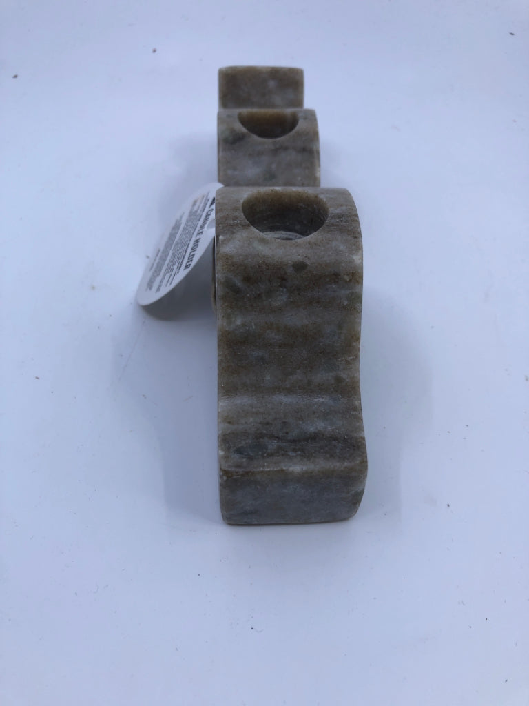 2 STONE WAVY TAPER CANDLE HOLDERS.