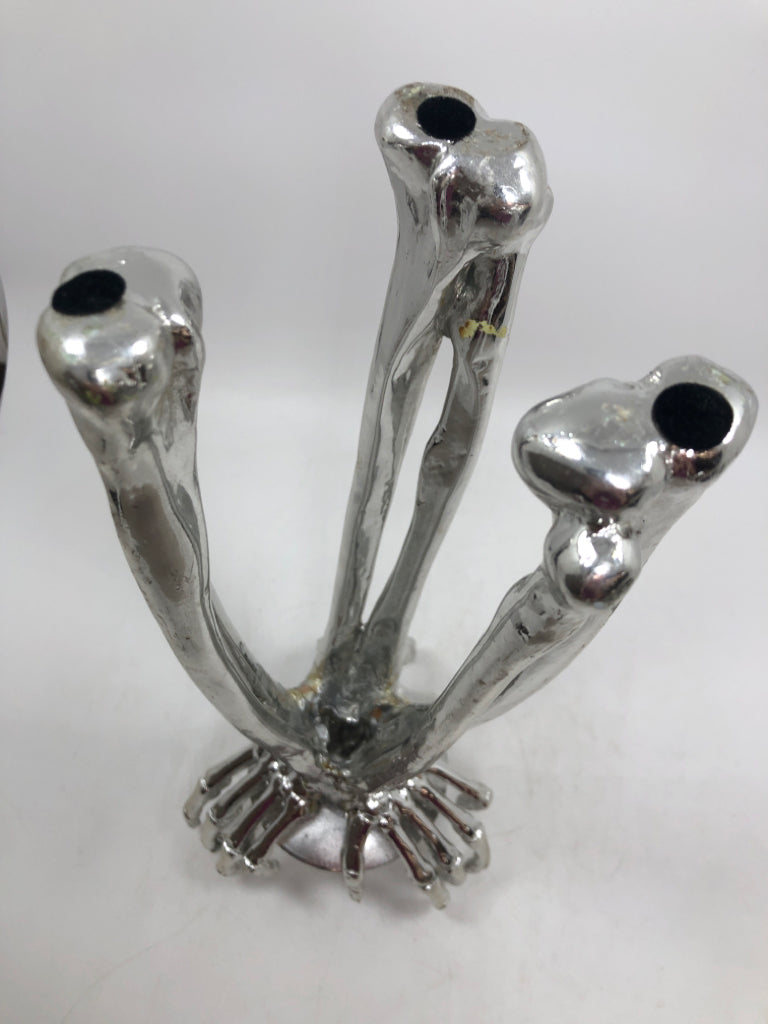 SILVER SKELETON HANDS PILLAR CANDLE HOLDER.