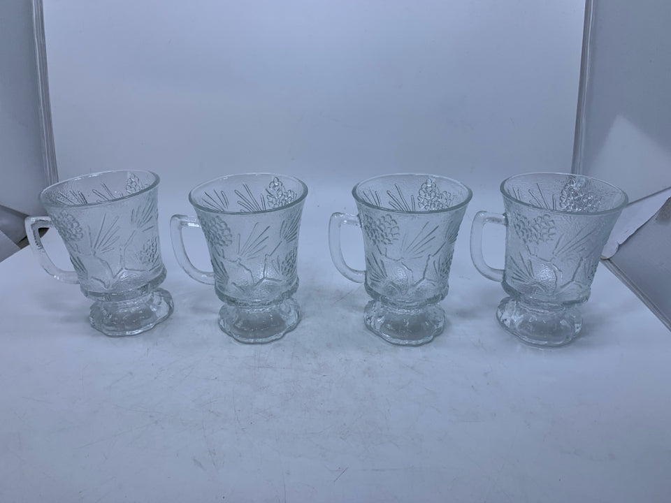 4 CLEAR FOOTED GLASS MUGS W/ EMBOSSED PINECONES.