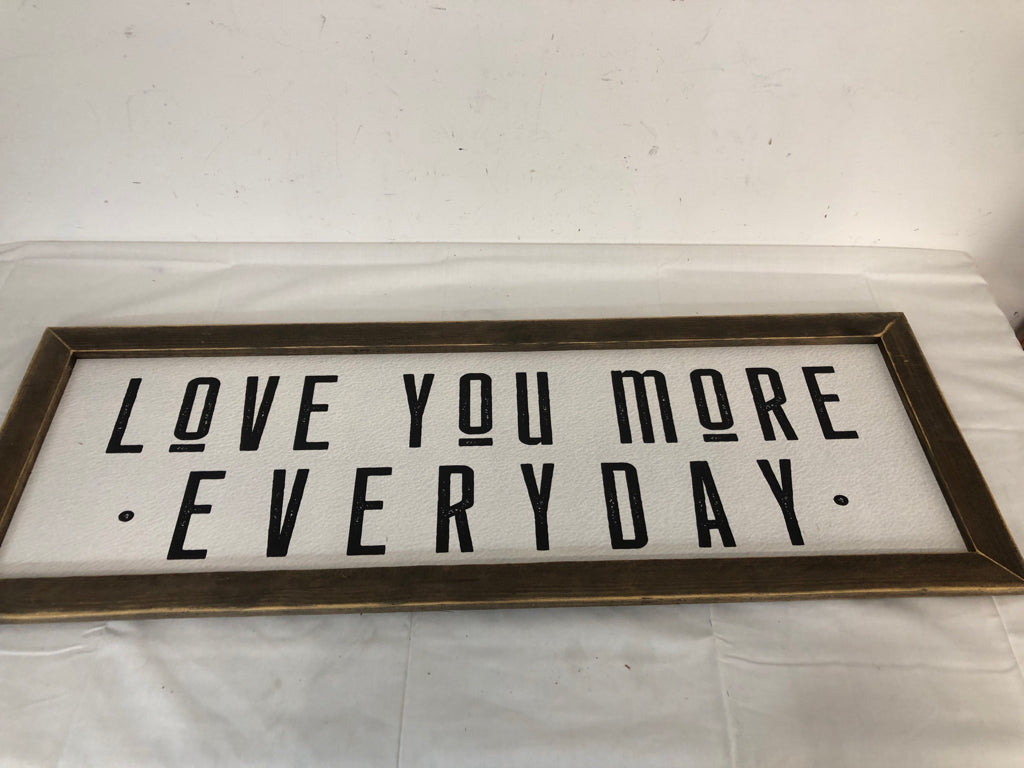 WOOD FRAME LOVE YOU MORE EVERYDAY BLACK LETTERS WHITE BACKGROUND.