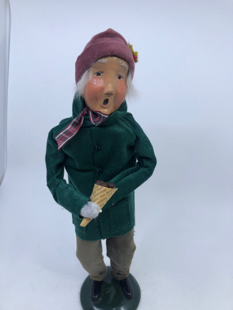 BYERS' CHOICE MAN IN GREEN COAT HOLDING NUTS-1993.