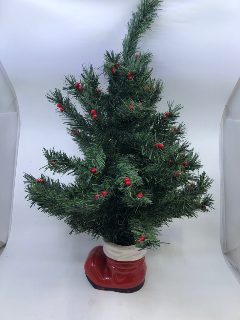 MINI HOLLY TREE IN SANTAS BOOT.