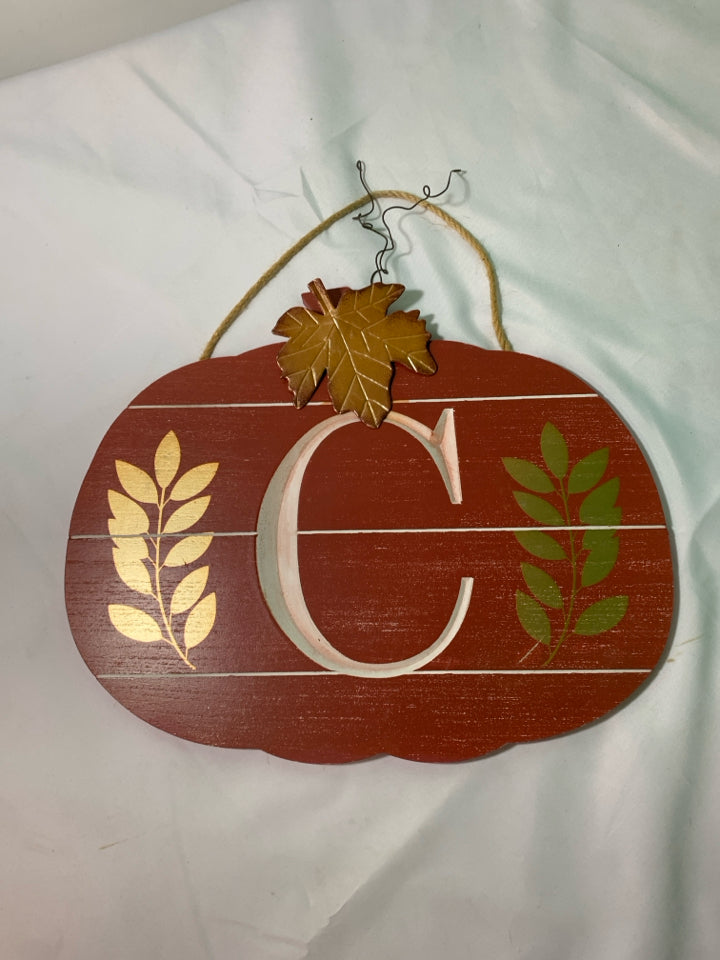 RED PUMPKIN SHAPED WALL ART W/ MONOGRAM C METAL LEAVES.