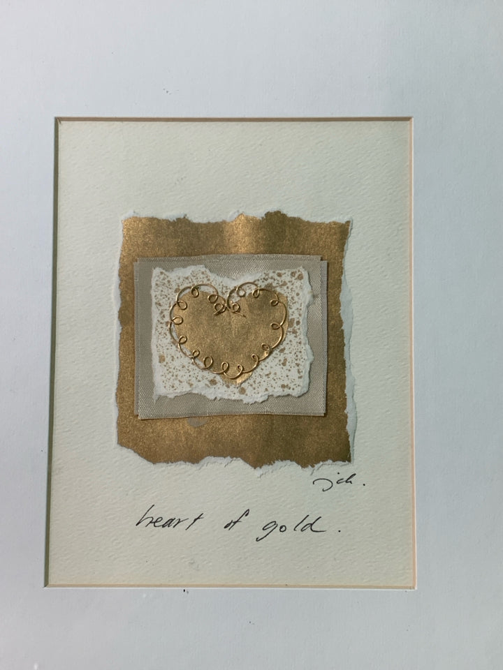 SMALL HEART OF GOLD WALL HANGING IN GOLD FRAME.