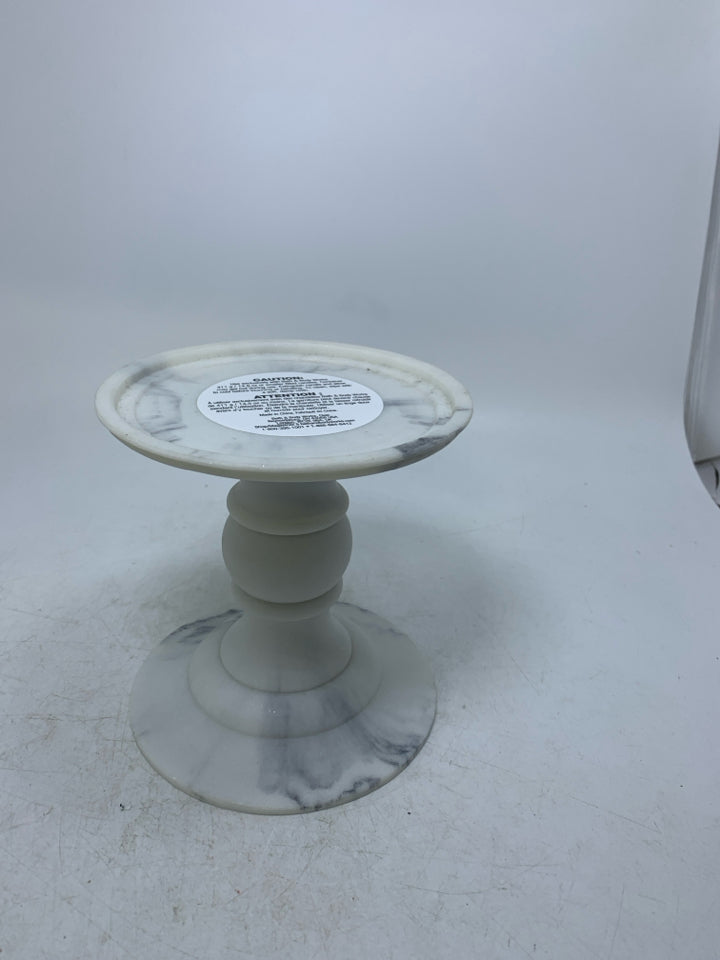 FAUX FOOTED MARBLE PILLAR CANDLE HOLDER.