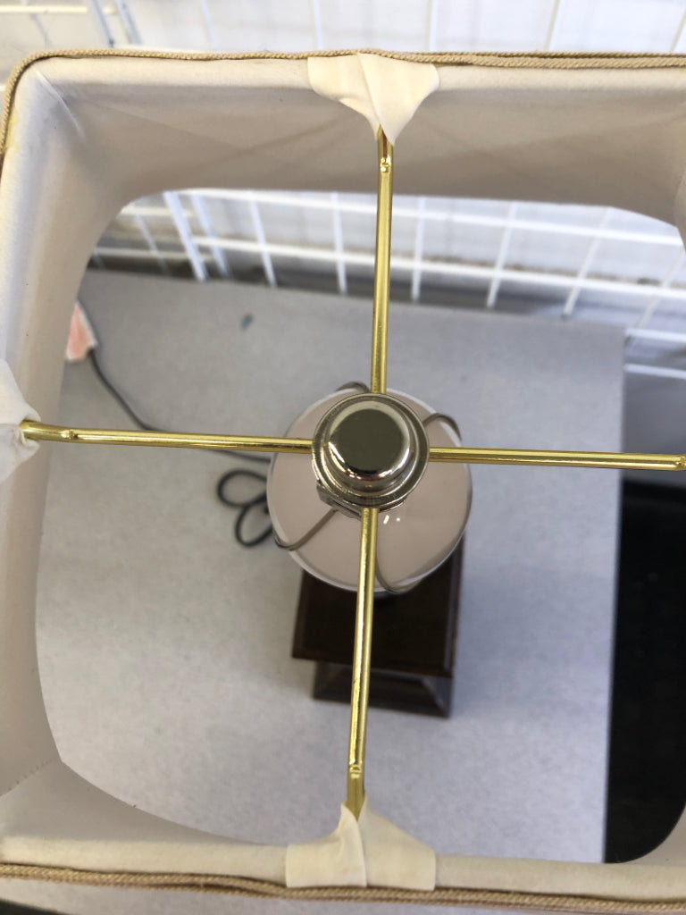 DARK WOOD BASE LAMP W/TAN FABRIC SHADE.