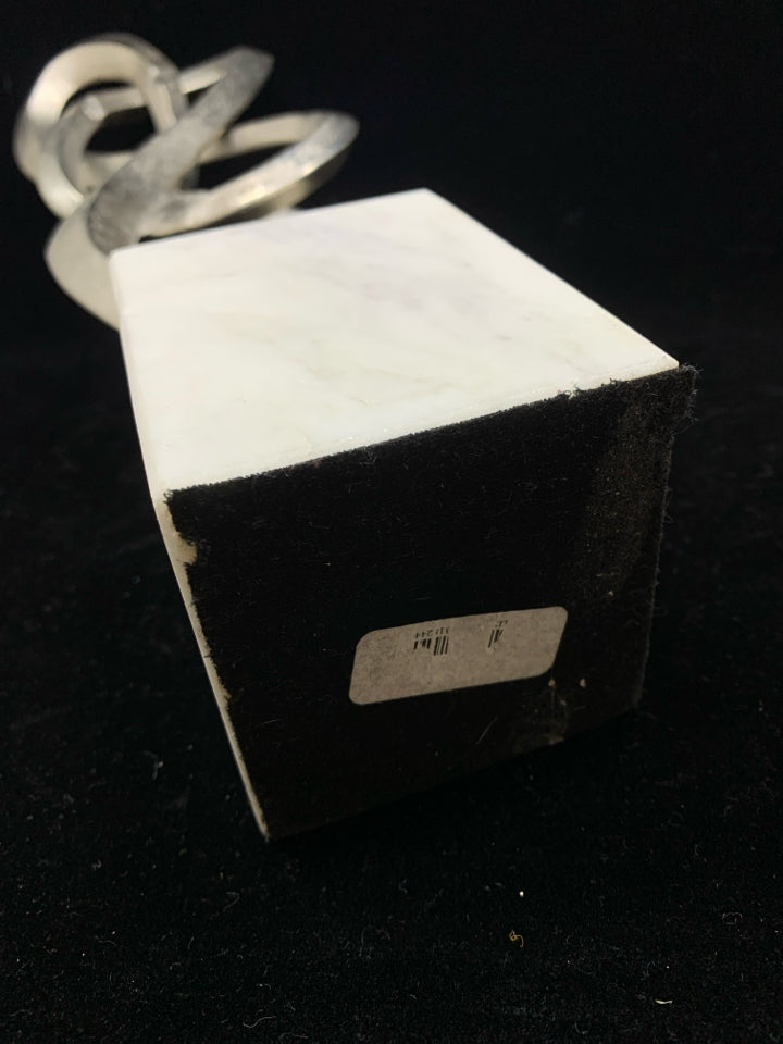 ABSTRACT METAL SCULPTURE ON MARBLE BASE.