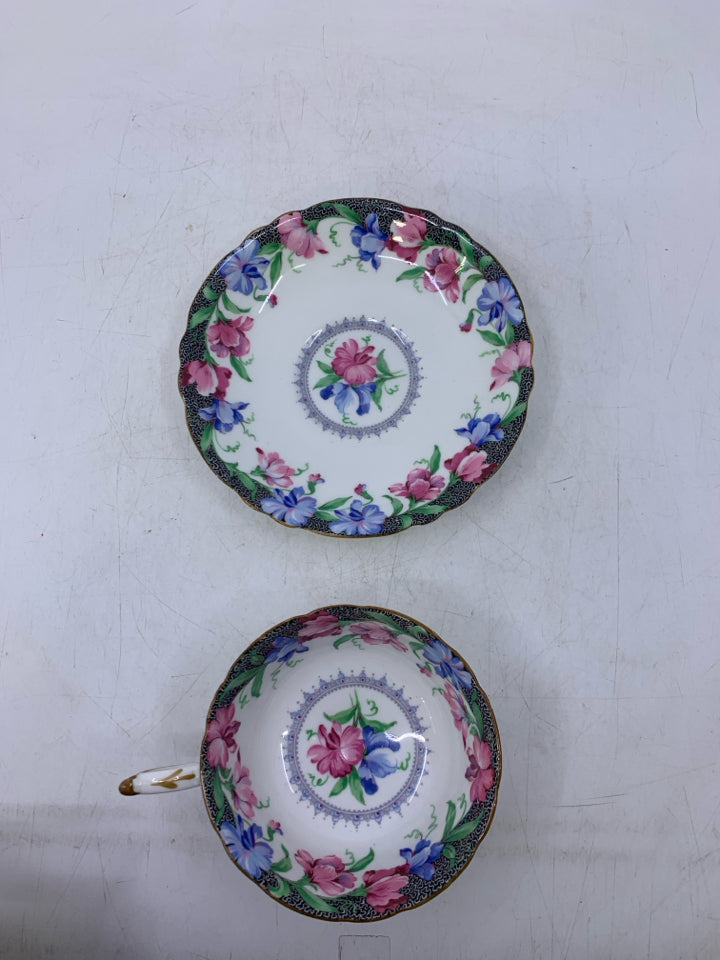 BLUE,PINK FLOWERS W/ BLACK EDGE.