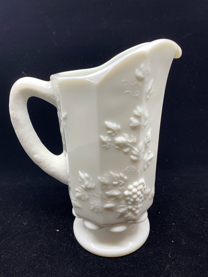 VTG MILK GLASS FOOTED PITCHER W/ EMBOSSED GRAPES +VINES.