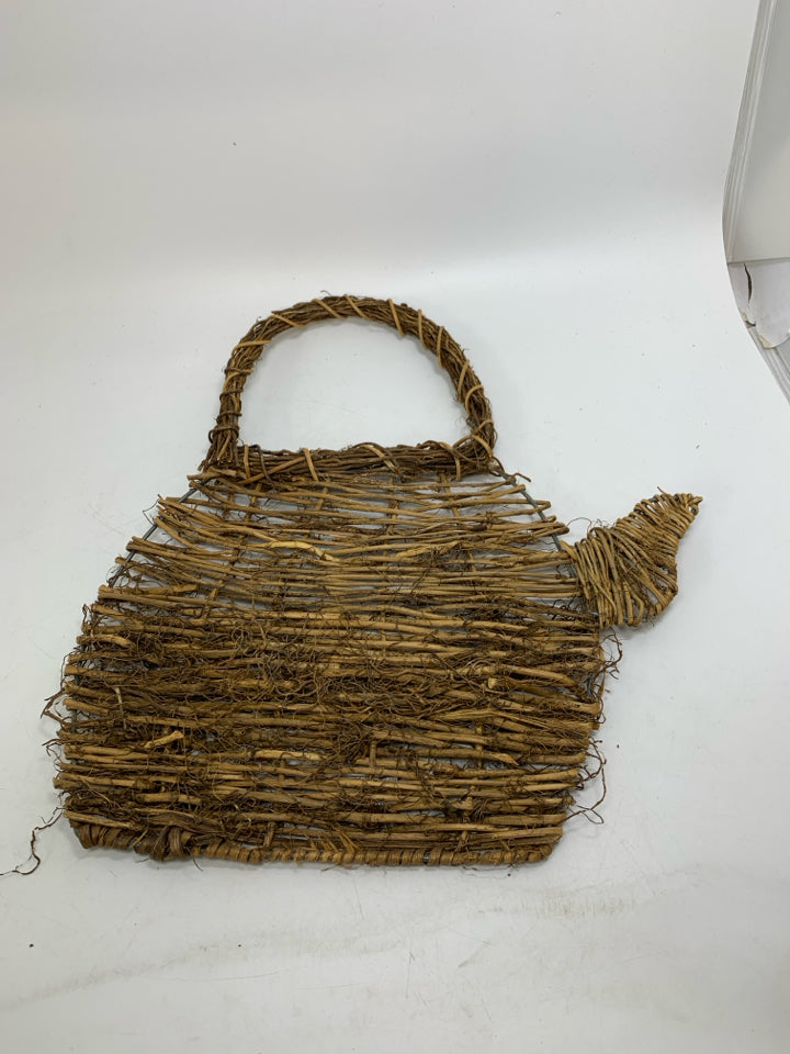 STICK WOVEN TEA POT SHAPED WALL HANGING.