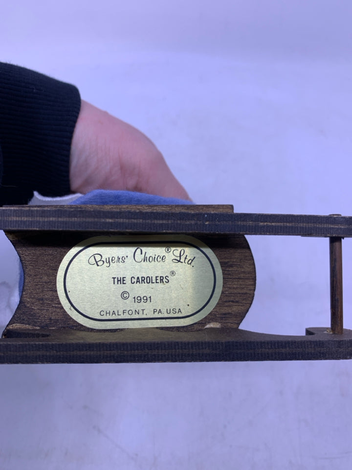 KID IN LIGHT BLUE SUIT ON SLED W/ DOG BYERS' CHOICE 1991.