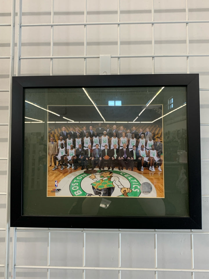CELTICS TEAM PHOTO IN BLACK FRAME.