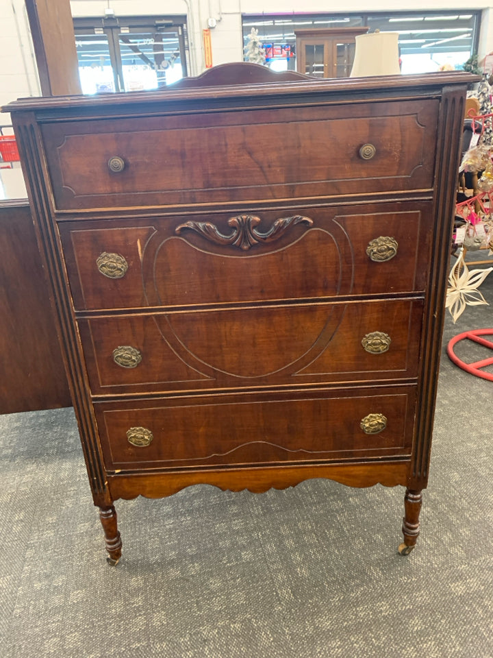 VTG TALL DRESSER W 4 DRAWERS ON WHEELS.