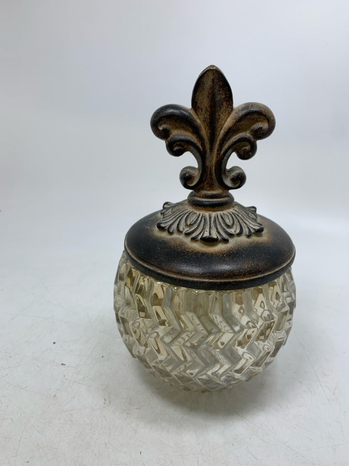 TEXTURED GLASS VASE W/ RESIN SCROLL LID.
