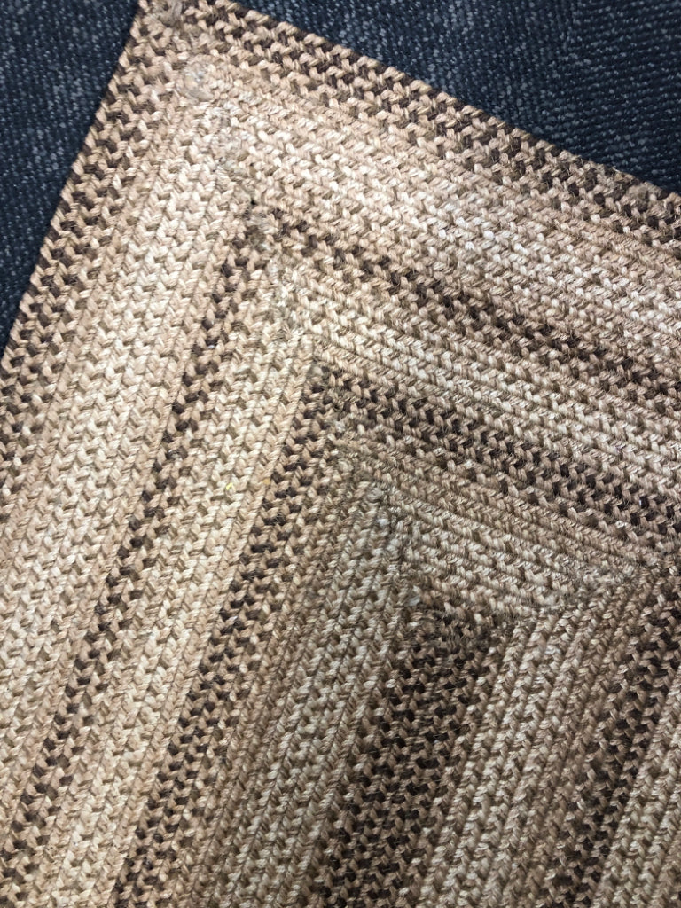 BROWN BRAIDED RECTANGLE AREA RUG.