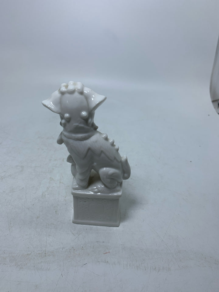 PORCELAIN FOO DOG FIGURINE.