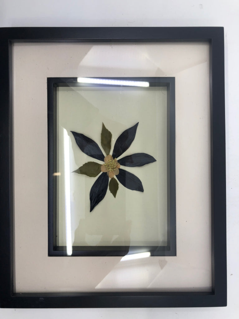 DRIED FLORAL IN BLACK FRAME.