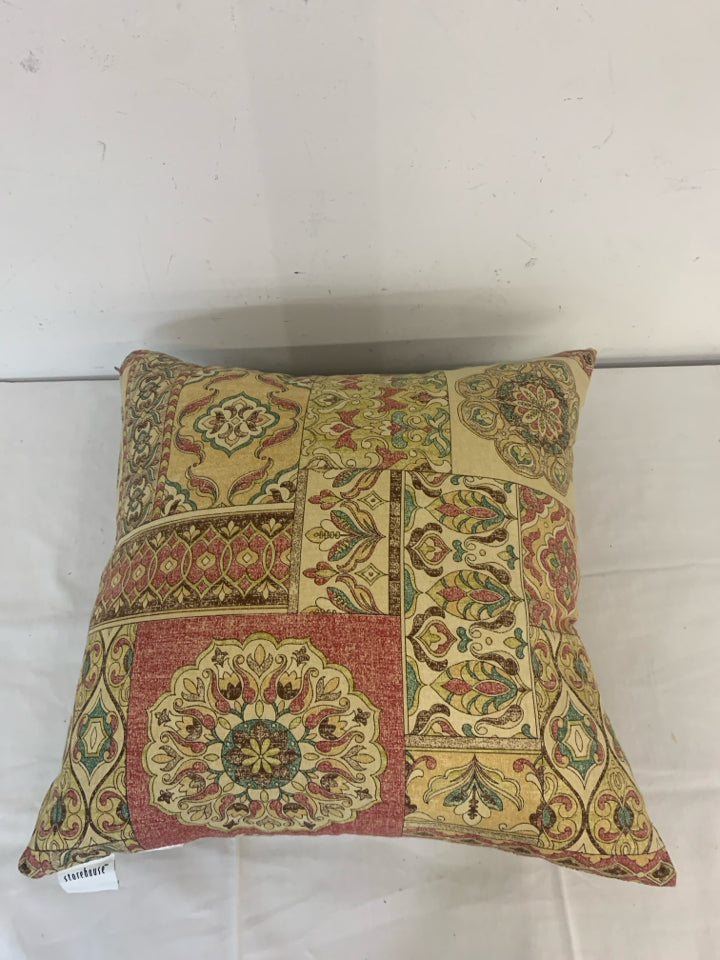 RED AND TAN MANDALA PATTERN PILLOW.